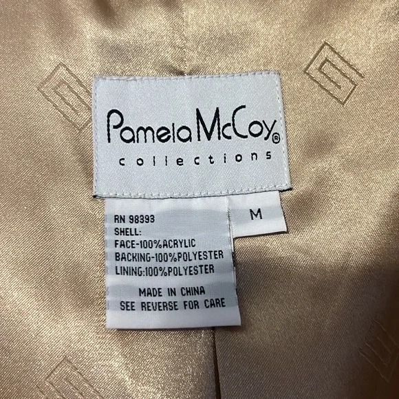 Selling this beautiful Pamela Mccoy fur coat; size Medium. Dry clean only.